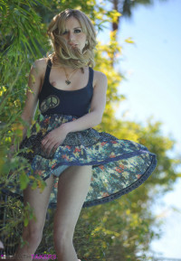 Kelly Klass outdoors in her short summer dress