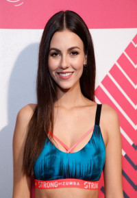 Victoria Justice busty in a tiny sports bra and tights