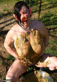 Thick amateur Mary Bitch drinks her own pee while playing in mud like a sow