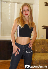 Beautiful teen uses a dildo to pleasure herself