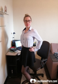 Office worker in black stockings shows her goods