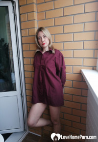 Incredible MILF displaying her tits by the window