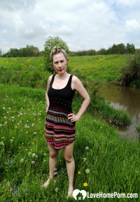 Sensational beauty being naked in the grass