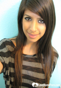 Brunette teases a bit in the bathroom