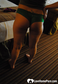 Her large tits shake as she fucks herself