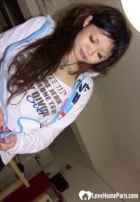 Stunning Asian gets completely naked on camera