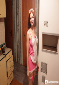 Housewife posing in a sexy maid outfit