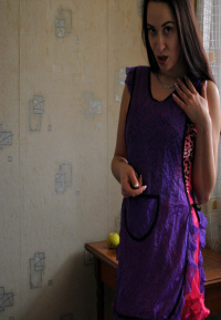 Brunette in stockings shoving a banana into herself