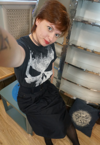 Sweet redhead gets naked in the office